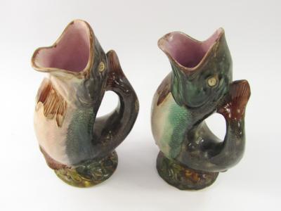 A near matching pair of 19thC Majolica gurgle fish jugs