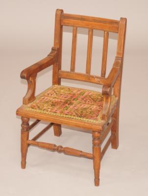 A late 19thC beech child's open armchair