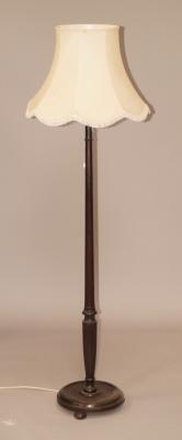 A turned mahogany standard lamp