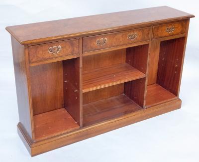 A walnut finish freestanding bookcase