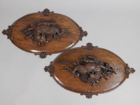 An unusual pair of late 19thC/early 20thC Black Forest carvings