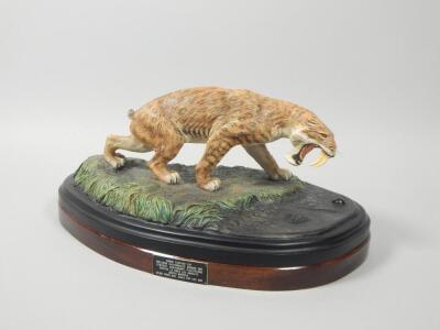 A hand painted model of a sabre tooth tiger by Carl Gage