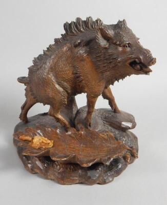 An early 20thC Black Forest carving in the form of a wild boar