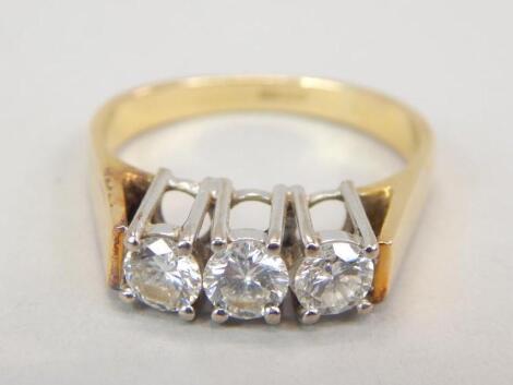 An 18ct gold three stone diamond ring