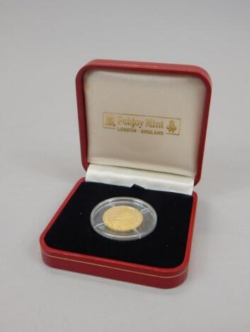 A commemorative 1/5 crown gold coin