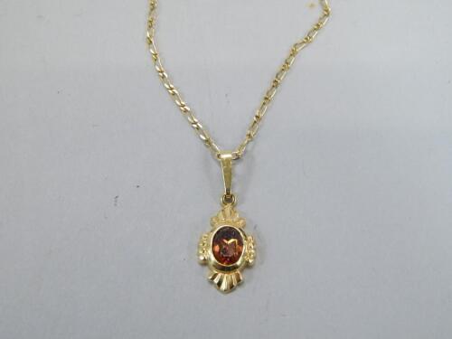 A 9ct gold pendant and chain