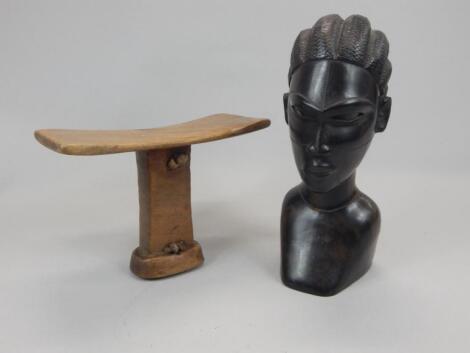 Tribal Art. A carved African head rest with woven hide handle and a hardwood bust carved in the for