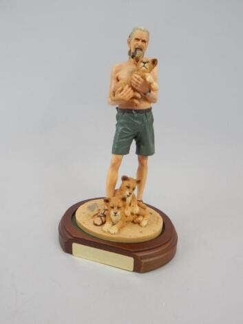 A limited edition hand painted figure of George Adamson and the last lions of Kora