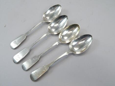 An associated set of four Fiddle pattern silver dessert spoons