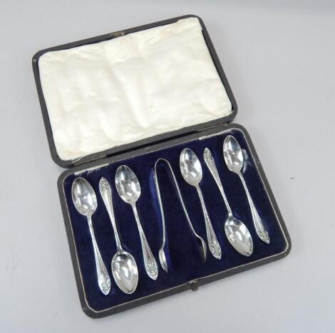 A set of six George VI silver teaspoons and matching sugar tongs