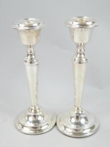 A pair of Elizabeth II silver candlesticks