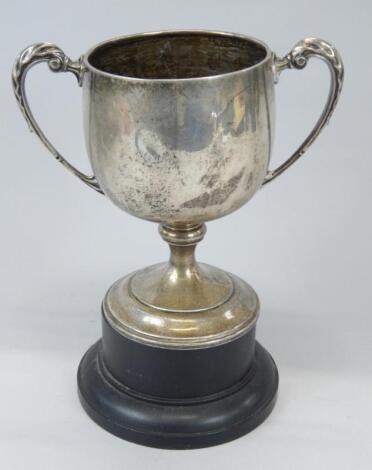 A silver two handled cup