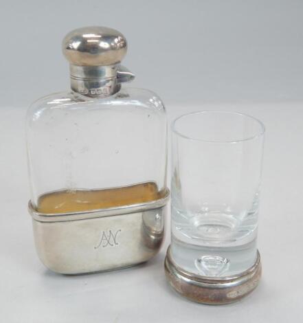 A small Edwardian silver and glass hip flask