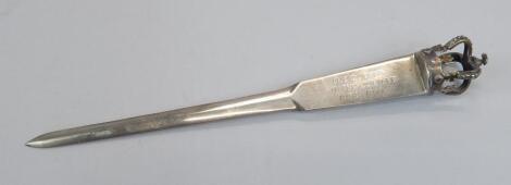 A silver commemorative paper knife