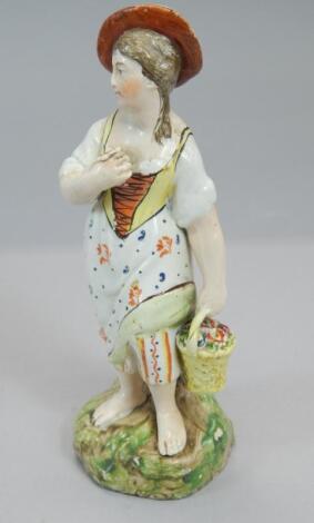 An early 20thC pottery figure of a lady