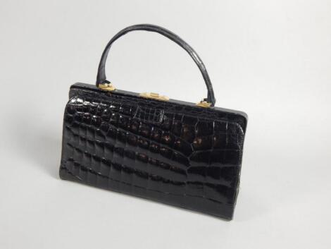 A 1920s/30s black crocodile skin handbag