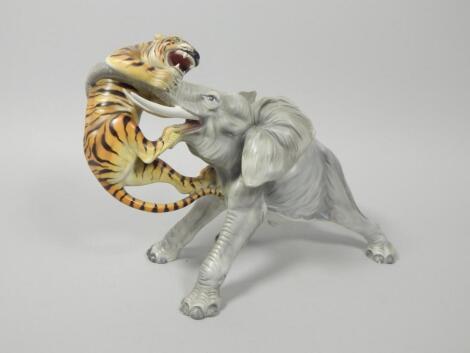 A Continental porcelain figure group in the form of a tiger attacking an elephant