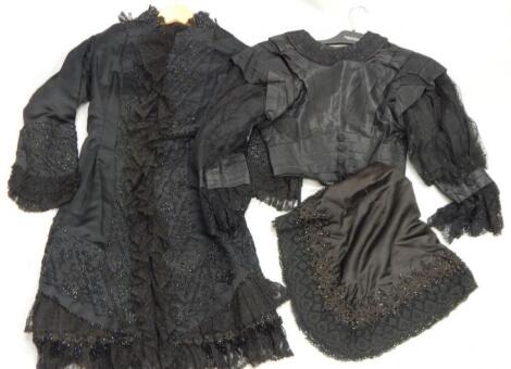 Two late 19thC/early 20thC black satin dresses