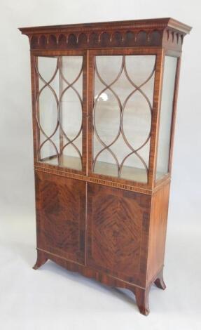 An early 20thC mahogany and chequer banded display cabinet