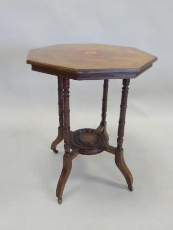 An Edwardian walnut two tier occasional table