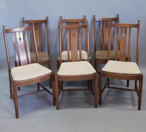 A set of six Ercol mid coloured elm dining chairs