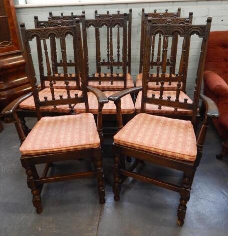 A set of eight Old Charm style oak dining chairs