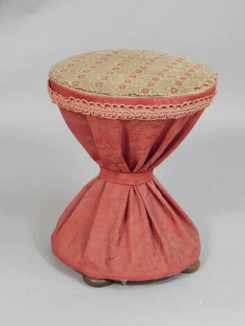 A Victorian hour glass shaped stool