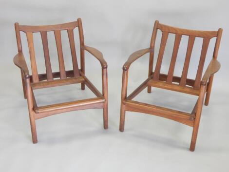 A pair of 1970s Retro style teak armchairs