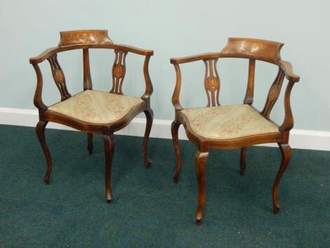 A pair of Edwardian mahogany and marquetry corner chairs