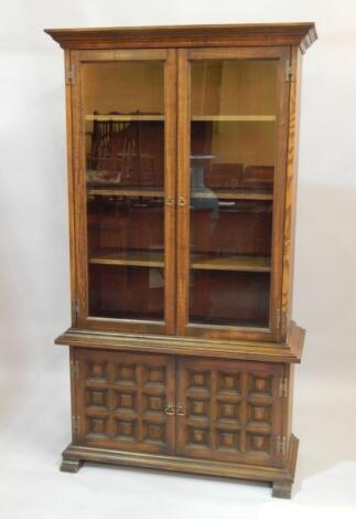 A modern Ercol style oak standing cabinet