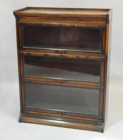 An oak Globe Wernicke type three tier bookcase