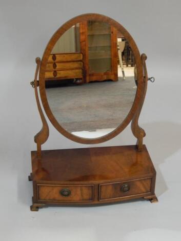 A reproduction figured mahogany dressing table mirror