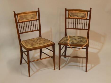 A pair of Edwardian inlaid bedroom chairs