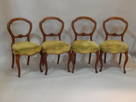 A set of four mahogany balloon back dining chairs