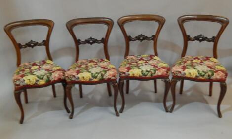 A set of four early Victorian rosewood balloon back chairs