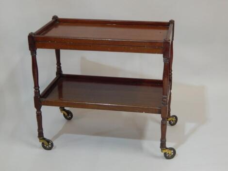 A mahogany two tier trolley