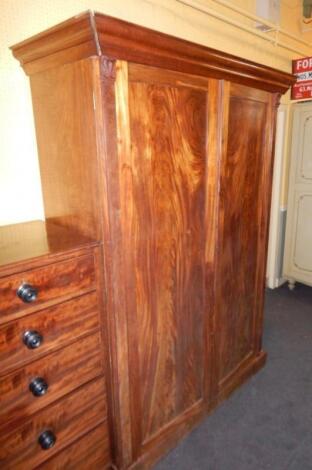 An early Victorian figured mahogany wardrobe