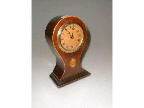 An Edwardian mahogany balloon mantel timepiece