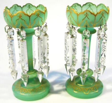 A pair of Victorian green glass lustres