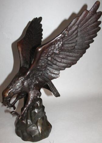 A 20thC spelter figure of an eagle