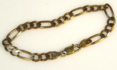 A yellow metal bracelet