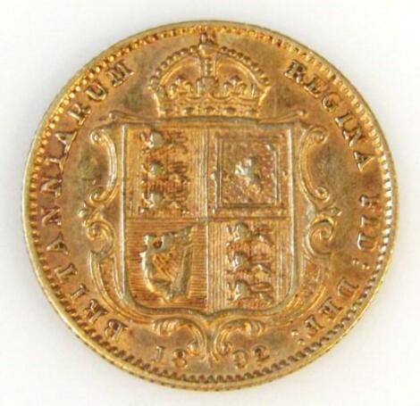 A Victorian shield back gold half sovereign