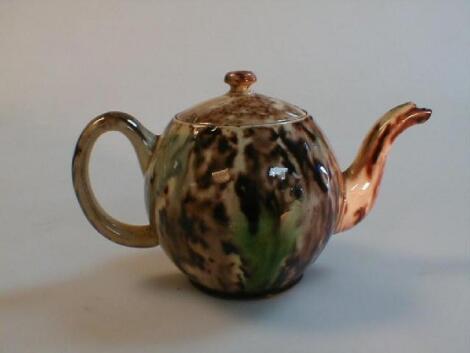 An 18thC Whieldon miniature bullet shaped tea pot £50-80