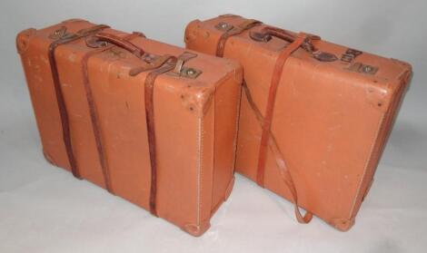 A matched pair of early 20thC pressed travel cases