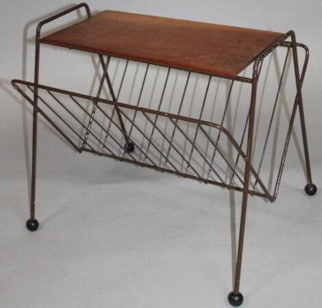 A 1960's retro teak and wirework newspaper rack