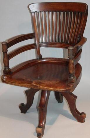 A 1920's mahogany stained office chair