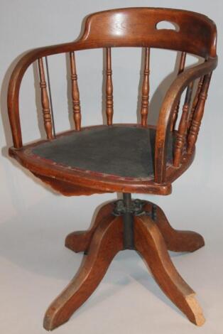 A 1920's oak swivel office chair