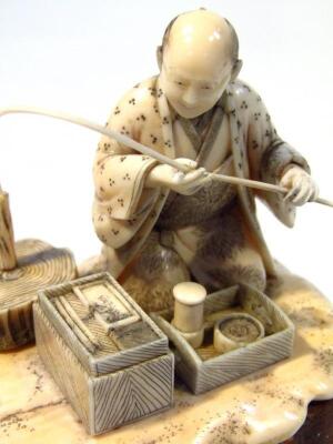 A late 19thC Japanese Meiji period okimono ivory figure group of a gentleman holding staff - 4