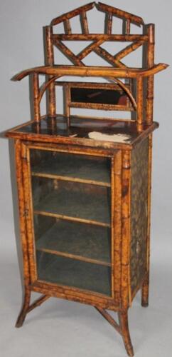 A late 19thC Chinese black lacquer and bamboo side cabinet