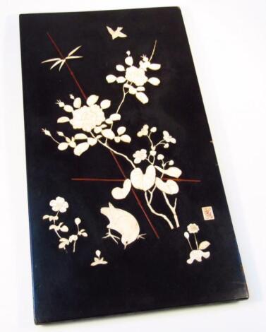 A 19thC ebonised ivory panel